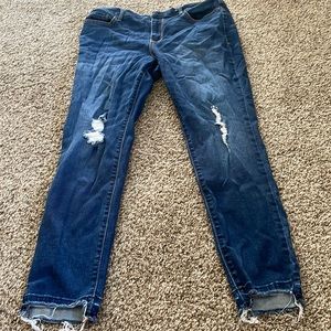 Lightly distressed dark wash jeans, clean, lightly worn